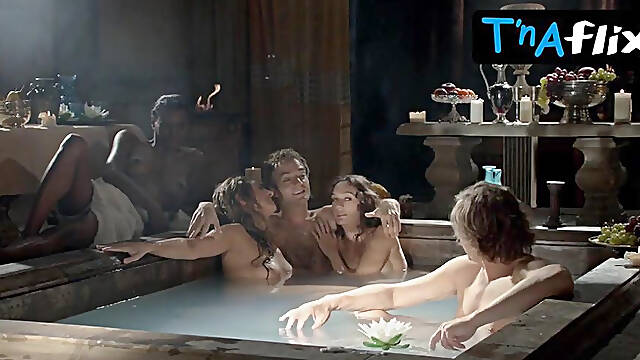 Jennifer Dubourg Breasts Scene in Peplum