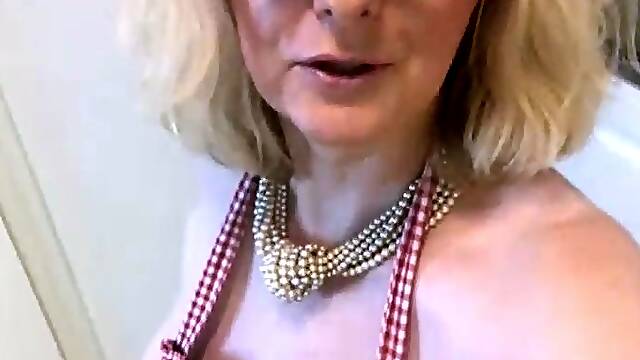 A super sexy blonde with big boobs and masturbating with a v