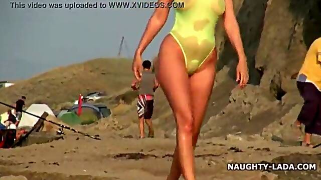 Transparent swimsuit and nude on the beach