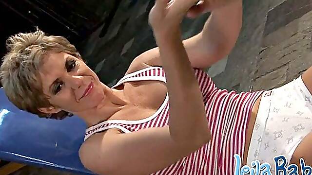 Horny sexy blonde MILF works out showing her big tits