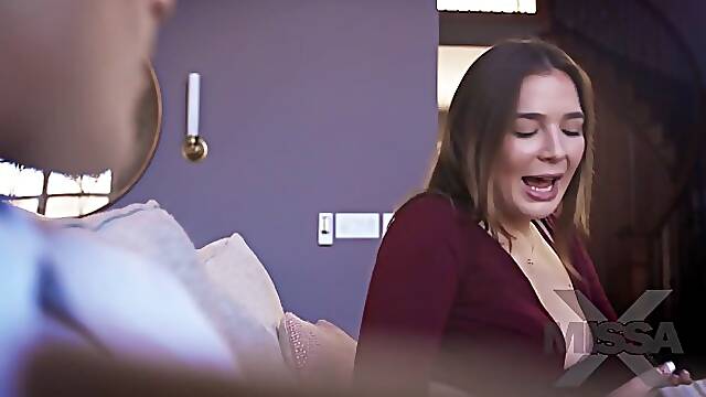 Blair Williams is gently rubbing her partner's dick while licking his balls at the same time