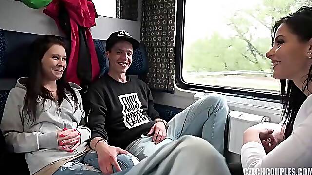 Two girls and two guys are having a foursome in the public train and enjoying it