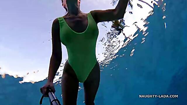 Busty MILF with ample assets likes to wear a sheer swimsuit, because it looks so sexy