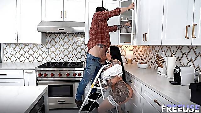 Big tits tattooed brunete MILF in stockings gets fucked by handyman in the kitchen