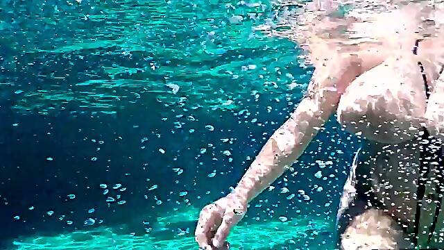 Three sets of huge, natural boobs underwater