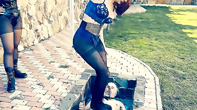 Mistress tramples foot slave in spiked boots