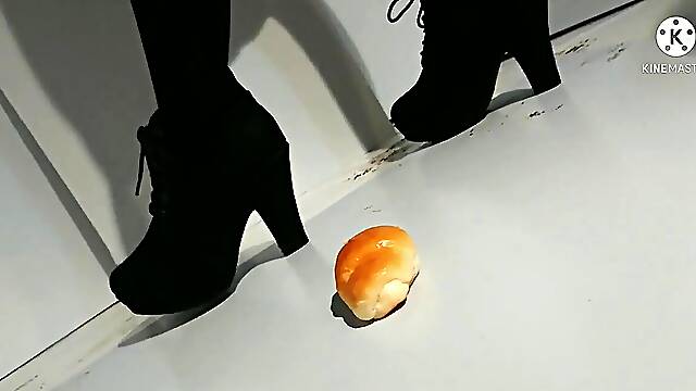 Slender Japanese crushes your boots and shows off her feet