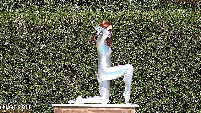 Bending in a Silver Spandex Suit