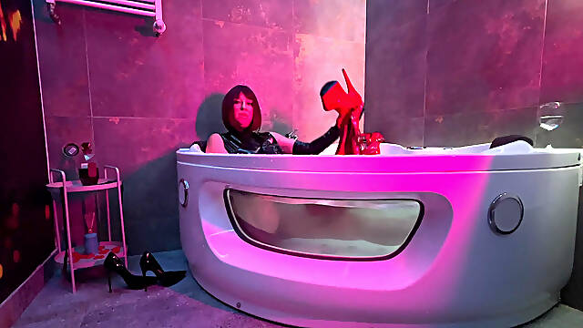 Mistress' Taking a Bath in Latex and Boots